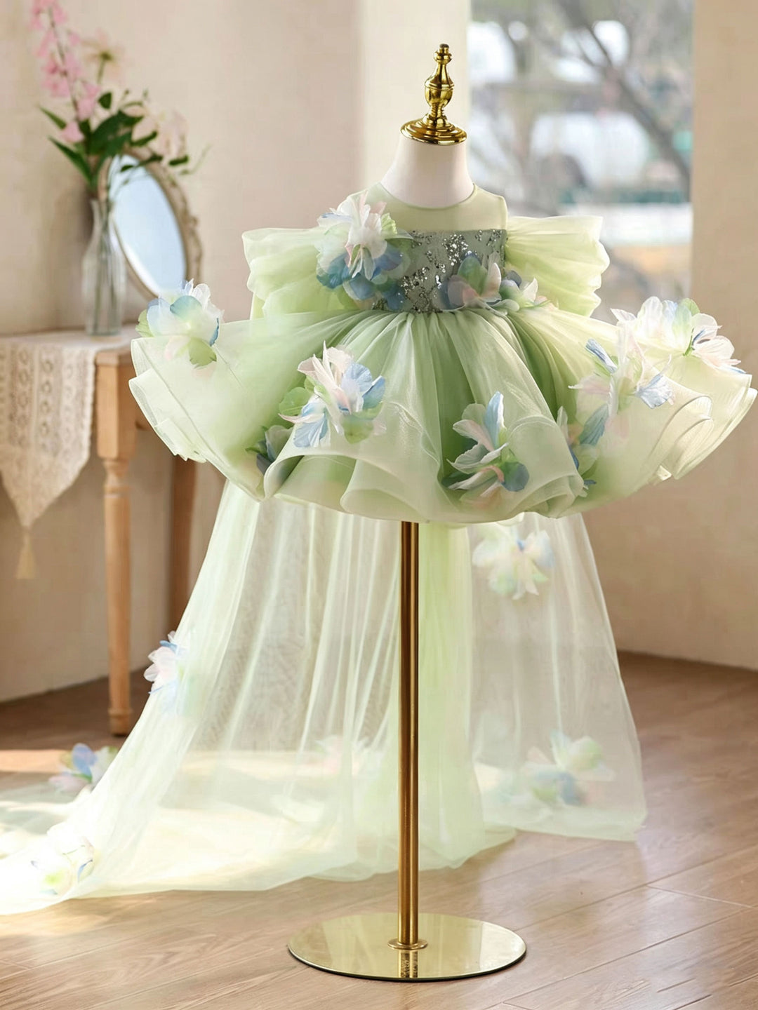 sage green flower girl dress Fable - her bateau neckline and narrow hand beaded belt sits atop a frothy layered handkerchief skirt Sage Green Flower Girl Dresses