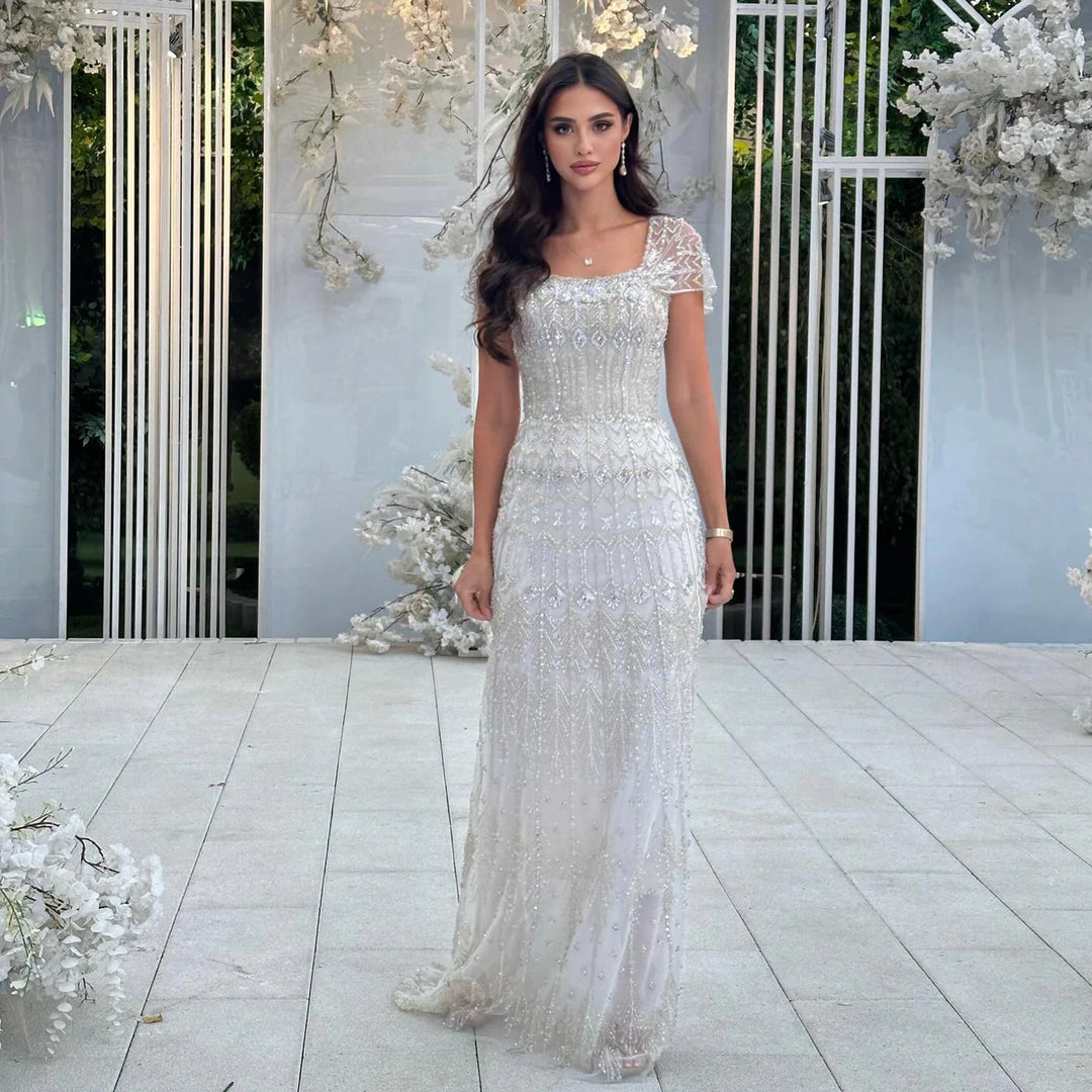 arabic lace mermaid wedding dress Off-Shoulder Arabic mermaid wedding dress overskirt with Detachable Train, 3D Lace Appliques, and Short Sleeves
