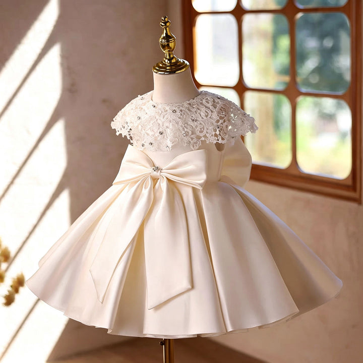 D295 off white lace cape flower girl dress front