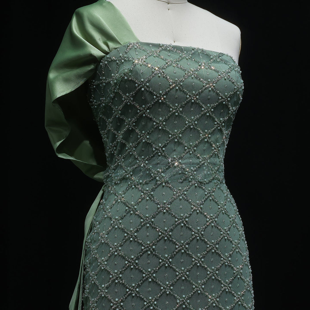 queen elizabeth one shoulder dress Queen Elizabeth II wore this sky blue and yellow one-shoulder gown with a swath of fabric draped across the skirt for a State Banquet held at the Royal Palace of Amsterdam. It